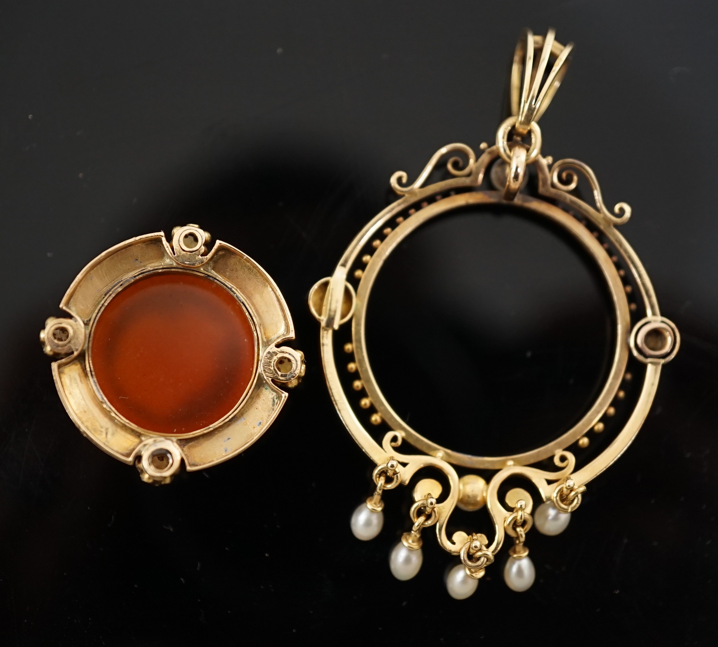 A Victorian gold, pearl, black enamel, and sardonyx hardstone cameo set drop pendant